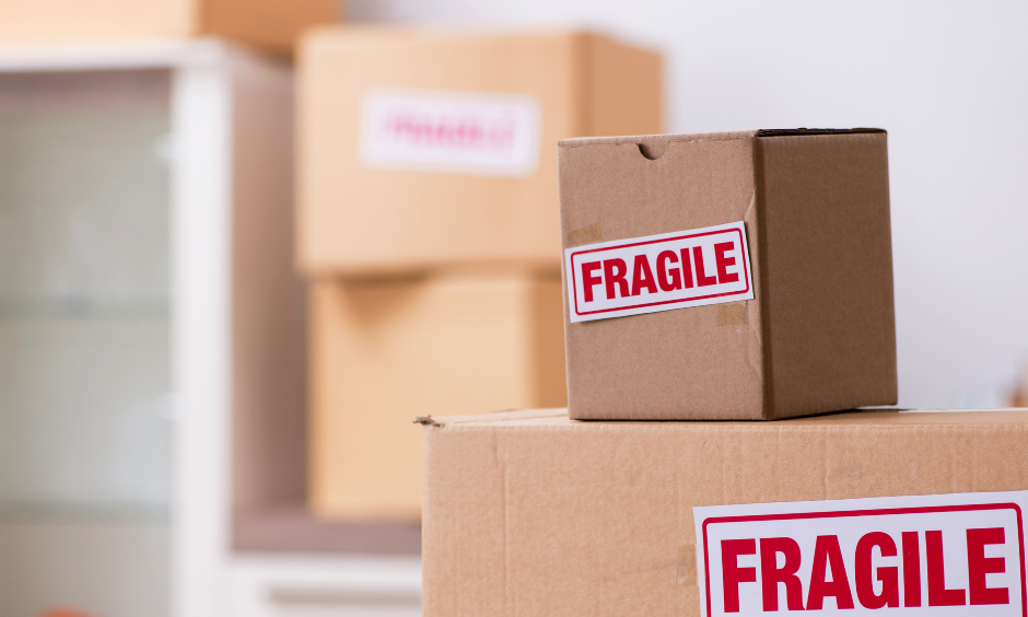 A photo showing several cardboard boxes labelled as "fragile".