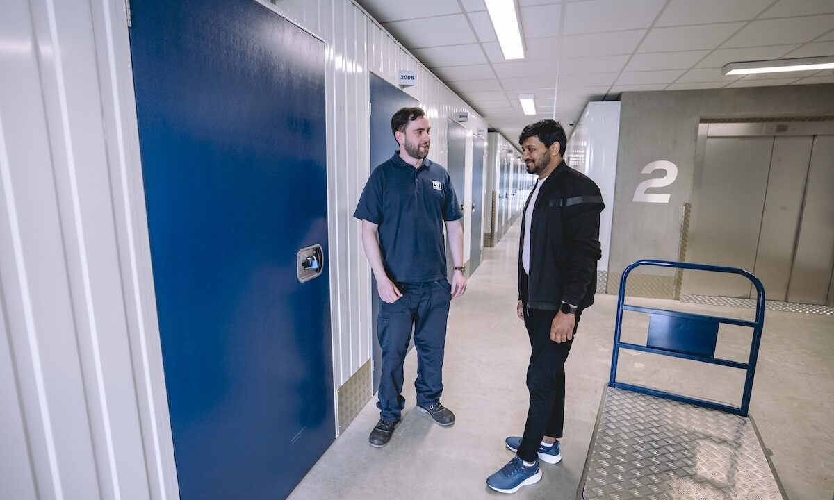 A photo of a Vanguard employee showing a customer around one of Vanguard's self storage branches.