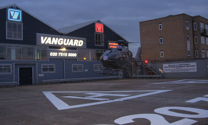 A photo showing Vanguard's helipad with an helicopter taking off.