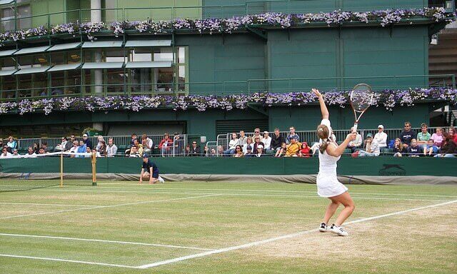 A photo showing a tennis game being played at Wimbledon.