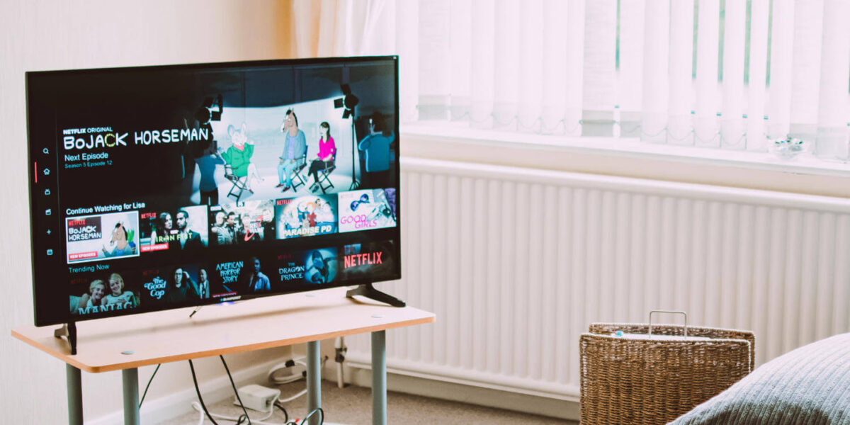 A photo showing a table on a small unit next to a radiator in a living room.