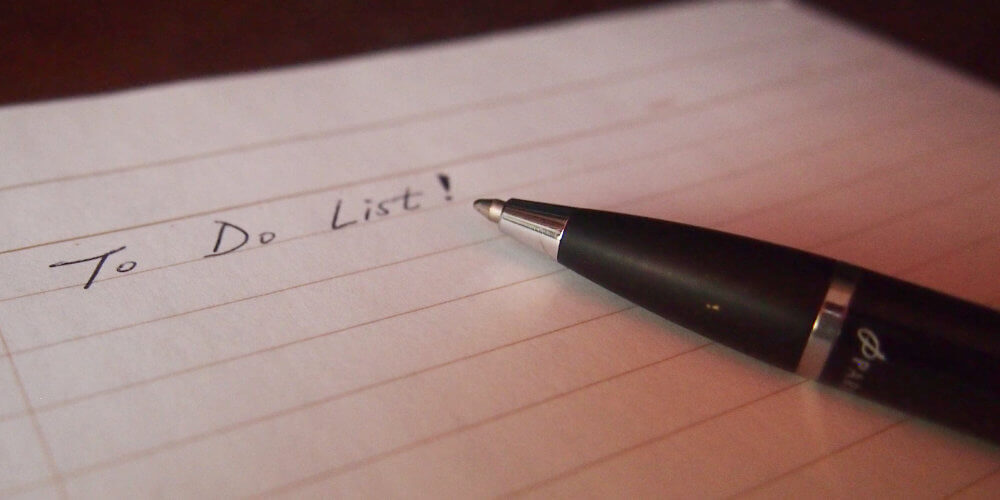 A photo showing a pen and paper titles "To Do List".