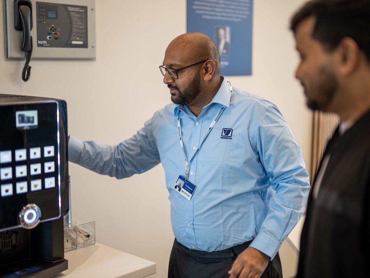 A photo showing a Vanguard employee assisting a customer at one of the Vanguard Self Storage branches.