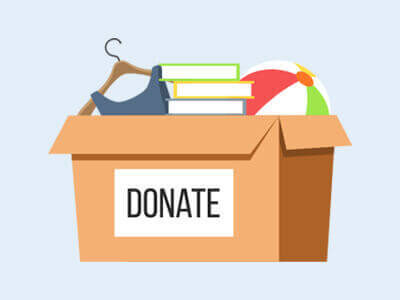 A graphic showing a donation box containing a dress, some books and a ball.