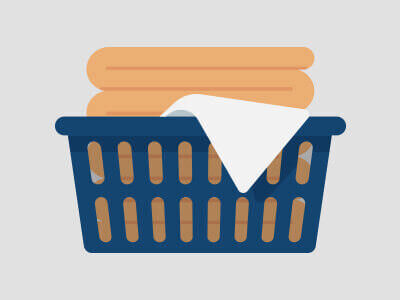 A graphic showing a blue laundry basket with a yellow blanket folded inside.