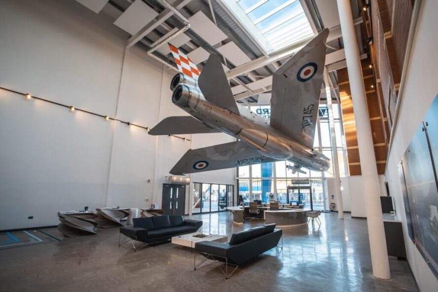 An interior shot of Vanguard's Bristol branch showcasing the fully restored English Electric Lightning fighter jet plane hanging in the reception.