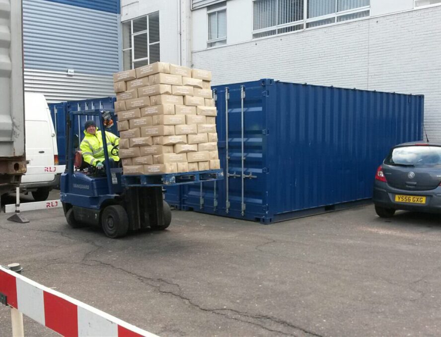 A photo showing a Vanguard employee moving some heaving materials with a forklift in one of the Vanguard Storage branches.