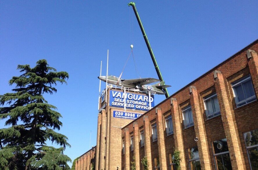 A photo showing a fighter jet placed on top of the tower at the Vanguard Self Storage branch in West London.