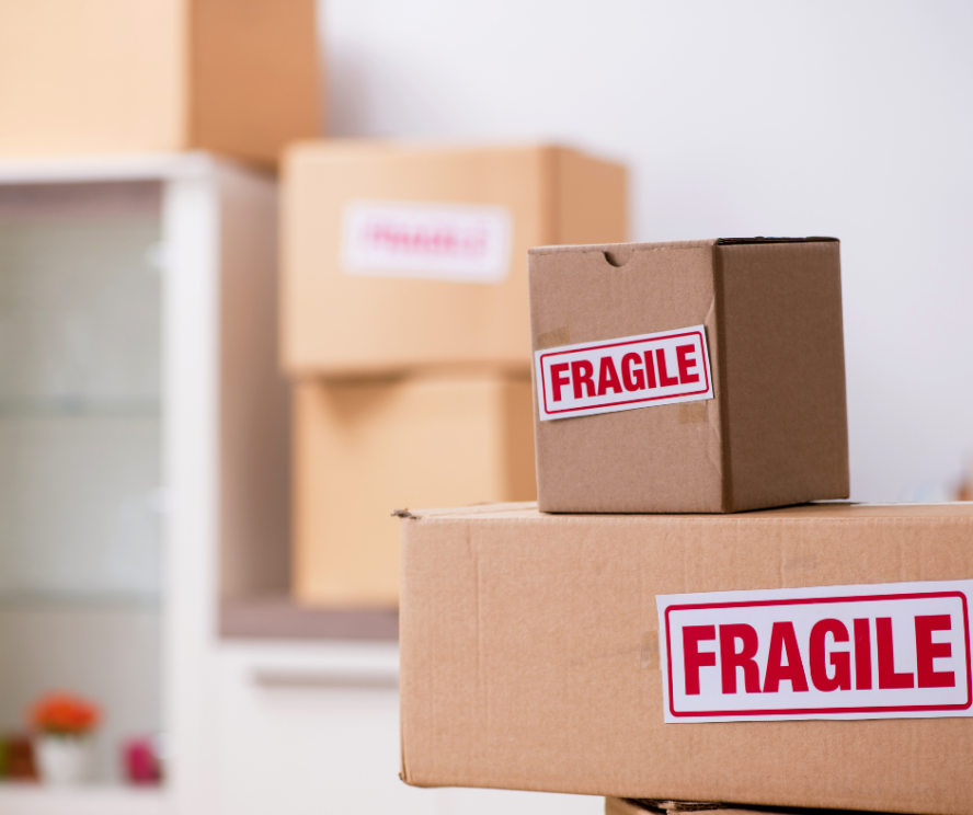 A photo showing several cardboard boxes labelled as "fragile".