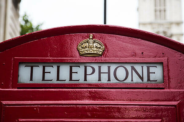A close-up photo of an old school phone cabin in London.