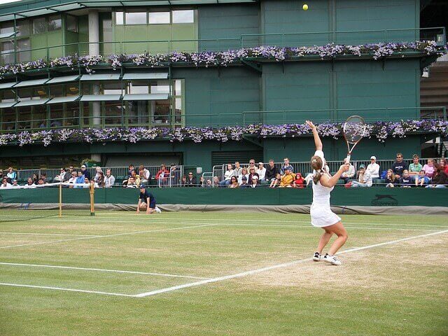 A photo showing a tennis game being played at Wimbledon.